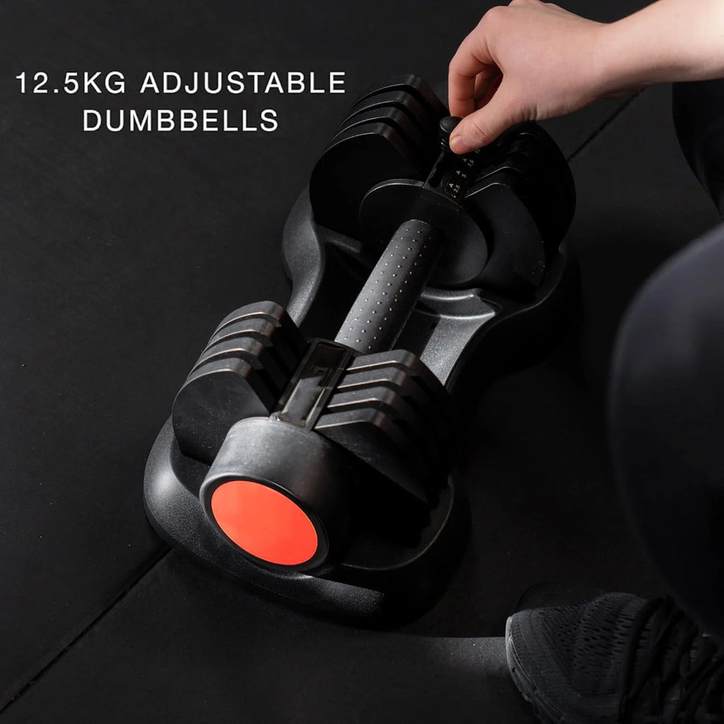 12.5KG adjustable dumbbells with a hand adjusting the weight on a black background