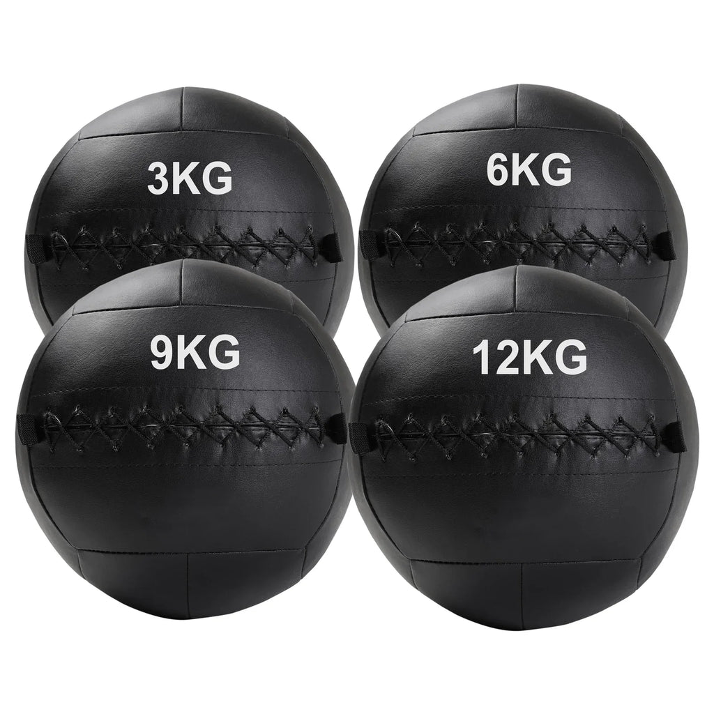 Four black weighted medicine balls with weight markings on a white background